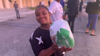 Girl holding a turkey